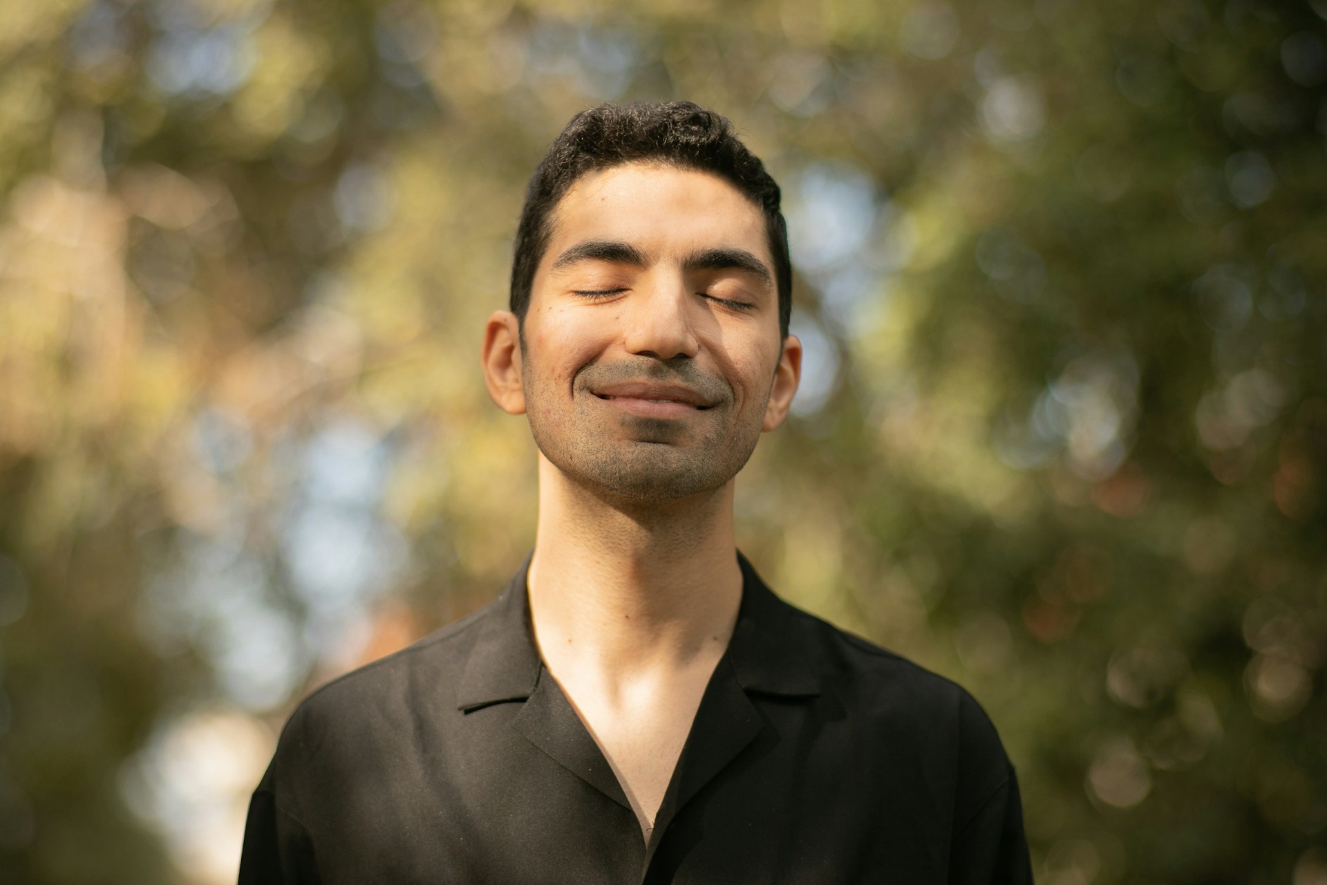 Man with Closed Eyes in Forest
